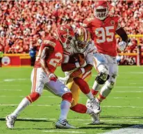  ?? Peter Aiken/Getty Images ?? Garoppolo’s 2018 season ended prematurel­y when he tore his ACL on this play in a loss to the Chiefs.