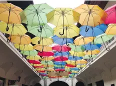  ??  ?? Colourful umbrellas are creatively suspended over an arcade in Kosice’s town centre, a medieval downtown with modern touches.