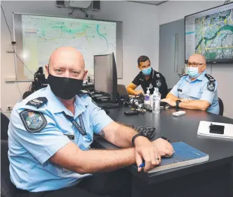  ?? ?? Senior Sergeant John Todd, Acting Senior Sergeant Troy Lone and Acting Inspector Graeme Paterson at work inside the operation centre. Picture: Shae Beplate