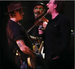  ??  ?? Sligo’s Steve Wickham (centre) with Johnny Depp and Bono at Shane McGowan’s 60th birthday concert in the National Concert Hall.