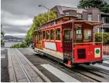  ??  ?? On track: A San Francisco cablecar commands an impressive view of Alcatraz