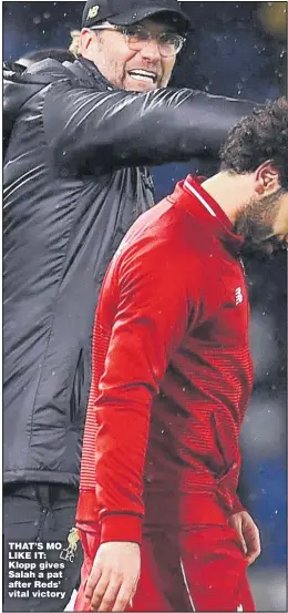  ??  ?? THAT’S MO LIKE IT: Klopp gives Salah a pat after Reds’ vital victory