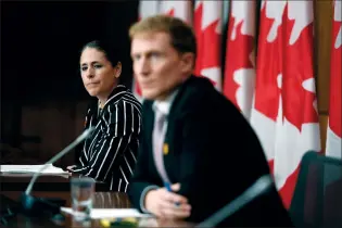  ?? CP PHOTO JUSTIN TANG ?? Indigenous Services Canada Associate Deputy Minister Valerie Gideon listens as Minister of Indigenous Services Marc Miller speaks during a news conference on the COVID-19 pandemic in Ottawa, on Friday.