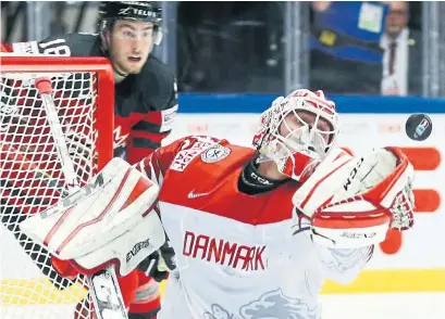  ?? PETR DAVID JOSEK/THE ASSOCIATED PRESS ?? There was no all-Leafs goalie matchup on Monday as Sebastian Dahm, a former OHL netminder, started for Denmark.