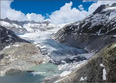  ?? (File Photo/ap/matthias Schrader) ?? A lake of meltwater has formed June 13 on the tongue of the Rhone Glacier near Goms, Switzerlan­d.