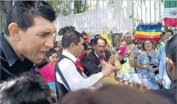  ?? Julián Cardona For The Times ?? A MARIACHI BAND plays for the mourners at Juan Gabriel’s block-long mansion in Ciudad Juarez, Mexico. The 66-year-old singer died in Santa Monica on Sunday, hours before he was to perform in El Paso.