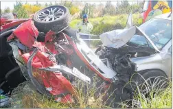  ??  ?? NOWHERE TO GO: The Nissan (right) and the Mitsubishi collided on West Coast Rd, Waipapakau­ri Ramp, just before noon on Friday.