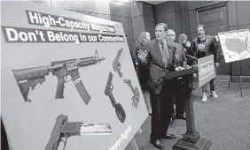  ?? AP PHOTO/ANDREW HARNIK ?? Sen. Richard Blumenthal, D-Conn., center, accompanie­d by Sen. Bob Menendez, D-N.J., third from right, speaks at a news conference on a proposed amendment to ban high capacity magazines in guns, on Capitol Hill, Tuesday in Washington.