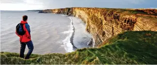  ??  ?? Celebratio­n of nature: Taking in the view at Nash Point, Wales Coastal Path