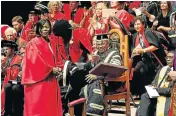  ??  ?? Receiving an honorary law degree at Rhodes University