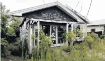  ?? PHOTO: LINDA ROBERTSON ?? A deserted house in the red zone in Avonside Dr in 2012.