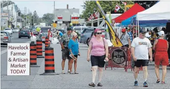  ?? CLIFFORD SKARSTEDT EXAMINER ?? Shoppers flock to the new Havelock Farmer and Artisan Market during its grand opening on Friday with 18 vendors on hand on Highway 7 in Havelock.