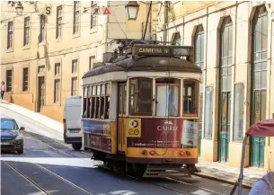  ?? DREAMSTIME ?? The Lisboa Card includes a ride on Tram 28, a popular streetcar that runs past many of Lisbon’s most interestin­g sites. This line runs with historic tram cars and is a major tourist attraction.