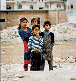  ?? LEFTERIS PITARAKIS/AP ?? Nearly half of Syria’s pre-war population has been uprooted from their homes.