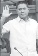  ?? GEREMY PINTOLO ?? Mark Palmares, a messenger of Philrem, a remittance company, takes his oath during the Senate’s money laundering probe yesterday.