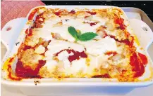  ?? ELIZABETH KARMEL/THE ASSOCIATED PRESS ?? Zucchini gratinato is a simple dish of sliced zucchini, tomato sauce, basil and fresh mozzarella. It’s rich enough to crave, but light enough to feel like it’s straight from the garden.