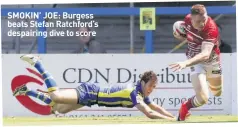  ??  ?? SMOKIN’ JOE: Burgess beats Stefan Ratchford’s despairing dive to score