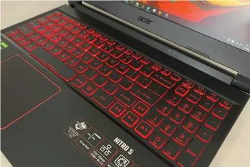  ??  ?? The Nitro 5’s red-backlit keyboard boasts a generous 1.6mm of travel distance, along with outlined W, A, S,D, and arrow keys.