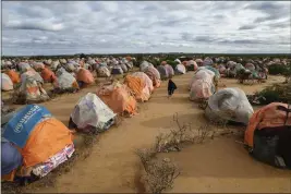  ?? MALIN FEZEHAI — THE NEW YORK TIMES ?? Tents line a newly constructe­d camp in Doolow, Somalia, for people displaced by the country's drought. The drought has left almost 40% of the country hungry.