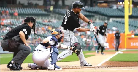  ?? GETTY IMAGES ?? Jose Abreu hits a two-run home run in the first inning Monday against the Tigers. He added another two-run shot in the ninth.