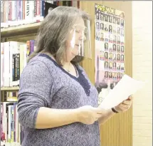  ?? Katie West • Times-Herald ?? Forrest City Public Library Children and Youth Services Coordinato­r Sheila Gracey shares with board members some of the memories that library patrons have shared with the facility so far as a part of the library’s 100th-year celebratio­n.