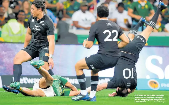  ?? Photo / Photosport ?? Oof! Beauden Barrett lands on his head after an illegal challenge in the air by Springboks winger KurtLee Arendse.