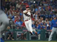  ?? MATT SLOCUM — THE ASSOCIATED PRESS ?? Philadelph­ia Phillies third baseman Scott Kingery throws to first after fielding a ground out by Chicago Cubs’ Jose Quintana during the third inning Tuesday.