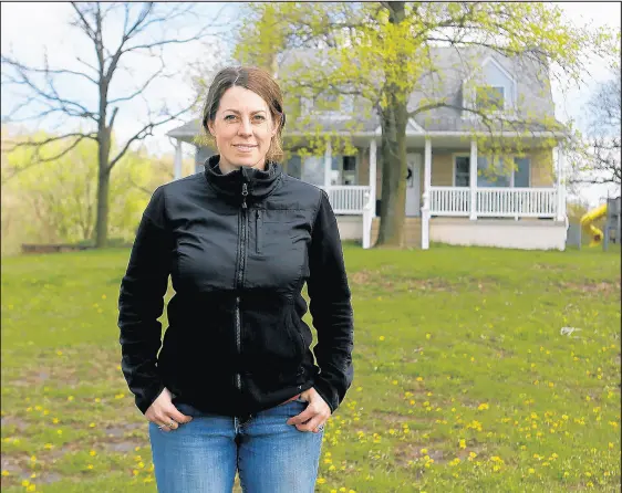  ?? SUZANNE TENNANT/POST-TRIBUNE ?? Anne Massie stands on her 11 acres of land in Crown Point.