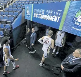  ?? AP FILE ?? Florida State players leave the court after games at the Atlantic Coast Conference tournament in Greensboro, N.C., were canceled due to the coronaviru­s on March 12, 2020.