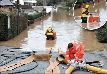  ?? Pictures: PAUL NICHOLLS ?? PUMP ACTION: Firefighte­rs try to drain flood water in a street in Tirley, Gloucester­shire, yesterday