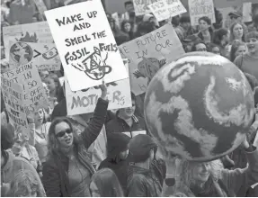  ?? JUSTIN SULLIVAN/GETTY IMAGES ?? Protesters in San Francisco join tens of thousands in 112 countries demonstrat­ing over the climate on March 15.