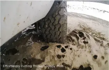  ??  ?? Effortless­ly cutting through soupy mud.