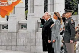  ?? ANNA MONEYMAKER/THE NEW YORK TIMES ?? President Trump and first lady Melania Trump join a V-E ceremony Friday at the World War II Memorial in Washington. The war began in 1939 when the Nazis invaded Poland.