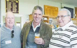  ??  ?? A couple of (then) youngsters in Drouin’s 1967 senior premiershi­p, Wayne Cochrane (left), now of Melbourne, and Robert Devries (centre) of Trafalgar catch up with Peter Nottage, who travelled from Queensland for the reunion.