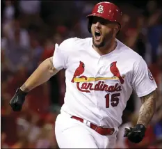  ?? AP PHOTO/JEFF ROBERSON ?? St. Louis Cardinals’ Matt Adams celebrates after hitting a two-run double during the eighth inning of a baseball game against the San Francisco Giants on Friday, in St. Louis.