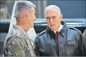  ?? MANDEL NGAN / POOL VIA AP ?? U.S. Vice President Mike Pence speaks to Gen. Nick Nicholson, commander of U.S. forces in Afghanista­n, in a hangar at Bagram Air Base in Afghanista­n on Thursday.