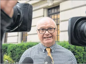  ?? CP PHOTO ?? Peter Myers, brother of actor Mike Myers, speaks with the media as disgruntle­d Sears employees gather at the Ontario Superior Court in Toronto on Thursday. Lawyers for Sears Canada employees are asking an Ontario judge to have the struggling retailer reinstate or continue their health benefits until October as the company restructur­es under court protection from creditors.