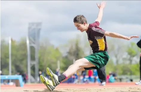  ?? MICHAEL BELL ?? Tommy Avram competed in the long jump competitio­n at the Regina High Schools Athletic Associatio­n track and field championsh­ips held at the Canada Games Athletics Complex on Thursday. Michael A. Riffel Catholic High School came out on top in the...