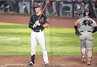  ?? PHOTOS BY MICHAEL CHOW/THE REPUBLIC ?? The Diamondbac­ks' Jake Lamb pauses after striking out against the Giants during the fifth inning at Chase Field in Phoenix on Sunday.