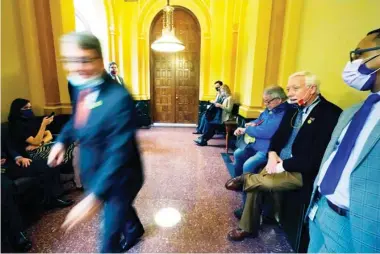  ??  ?? Rep. Hank Zuber, R-ocean Springs, rushes past lobbyists waiting to enter the House Ways and Means Committee meeting, Tuesday, March 2, 2021, at the Capitol in Jackson, Miss. Because lawmakers are under a Tuesday deadline for committees to report on general bills and constituti­onal amendments that originated in the other House, lobbyists are in attendance to see how their issues fare. (Photo by Rogelio V. Solis, AP)