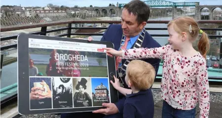  ??  ?? Deputy Mayor of Drogheda Richie Culhane gets a lesson in booking his tickets for the Drogheda Arts Festival from Ronan Ashwood (3) and his big sister Ciara Ashwood (6). The Festival takes place from 1-7th May and tickets are available on www....