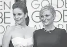  ?? JOHN SHEARER/ INVISION/ AP ?? Tina Fey and Amy Poehler will host the 78th Golden Globe Awards from two coasts.