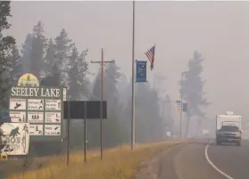  ?? Kari Greer / U.S. Forest Service 2017 ?? Seeley Lake, Mont., was blanketed with hazardous smoke for 49 days in 2017. A study showed residents’ lung capacity declined in the first two years afterward.