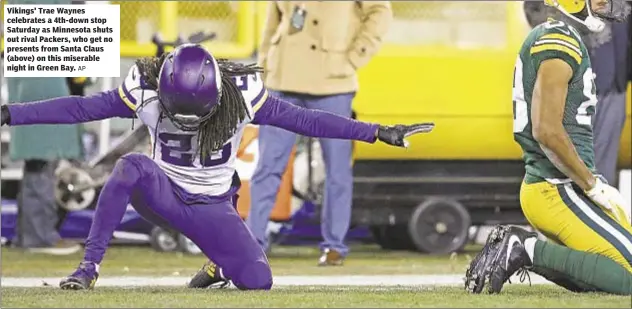  ?? AP ?? Vikings' Trae Waynes celebrates a 4th-down stop Saturday as Minnesota shuts out rival Packers, who get no presents from Santa Claus (above) on this miserable night in Green Bay.