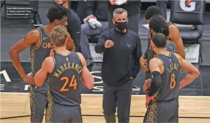  ?? JONATHAN DANIEL/GETTY IMAGES ?? Coach Billy Donovan (center) is “doing a great job,” boss Arturas Karnisovas says.