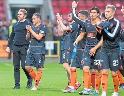  ?? Picture: SNS. ?? Robbie Neilson and his players celebrate with their supporters at full-time at Firhill.