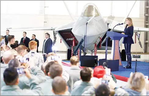  ??  ?? First Lady Melania Trump speaks in front of an F22 fighter during a tour of Joint Base Langley in Hampton, Va, on Dec 12. (AP)