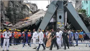  ?? — GETTY IMAGES FILES ?? Government officials visit the site of a collapsed flyover in Kolkata on Saturday. Rescue officials said that there are no more survivors trapped under the rubble of the overpass.