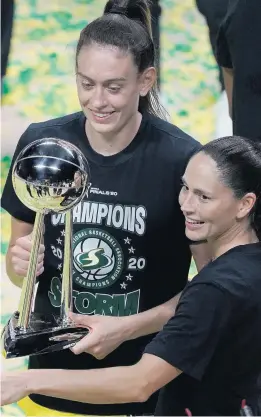  ?? CHRIS O'MEARA/ASSOCIATED PRESS ?? Seattle Storm forward Breanna Stewart, left, and guard Sue Bird celebrate after their team dusted the Las Vegas Aces 92-59 Tuesday night to finish a three-game sweep for the WNBA championsh­ip in Bradenton, Florida. Stewart was the unanimous Finals MVP.