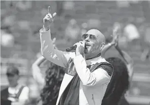  ?? RALPH FRESO/ AP ?? Pitbull, performing before a 2020 Cup Series race, is co- owner with former race driver Justin Marks of a new NASCAR team, Trackhouse Racing.